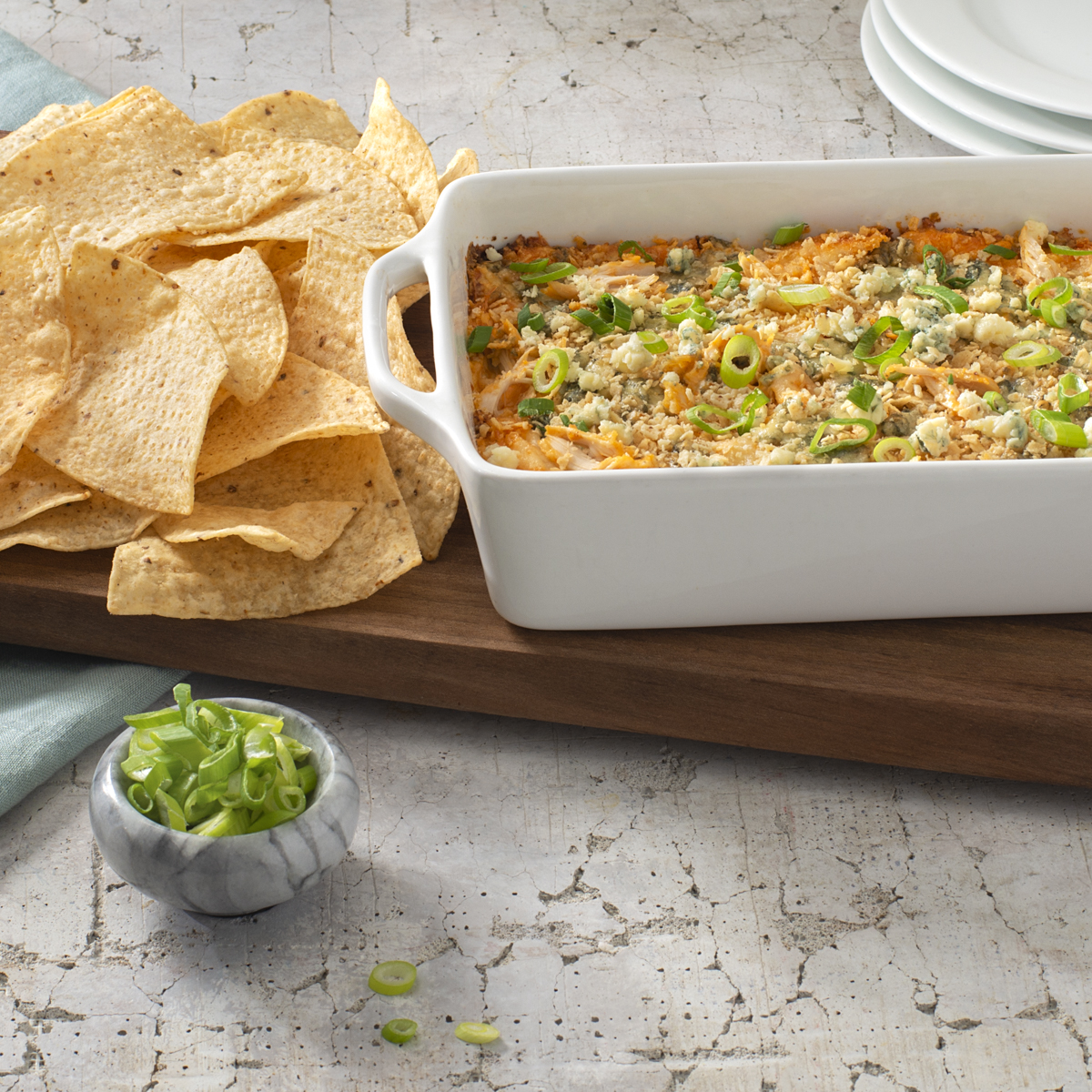 Warm TOSTITOS<sup>®</sup> Buffalo Chicken Dip & Tortilla Chips